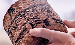 Kaayd hllngaay skaayxan (spruce-root basket), with Wasgo (Sea Wolf) imagery, c. 1890 – 1920. Woven by Skidegate Haida artist, and painted by Neeslant, John Cross (1867 – 1939)