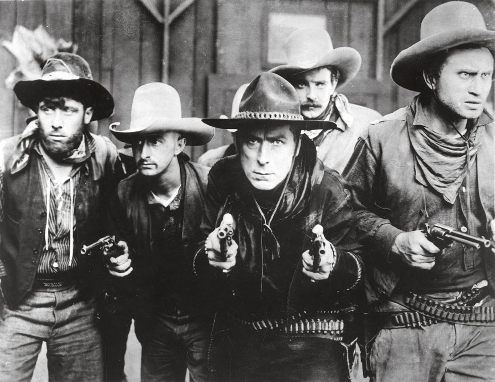 William S. Hart (centre) in "The Gun Fighter," 1917