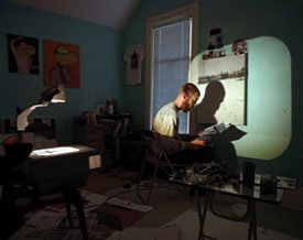 "An artist painting with the aid of an overhead projector"