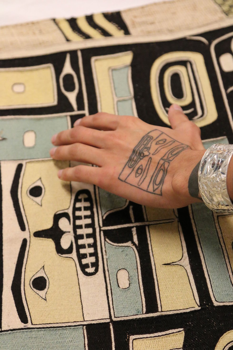 Chilkat robe and hand tattoo (image courtesy of Bill Reid Gallery, Vancouver)