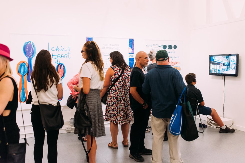 Visitors check out Teresa Pocock’s art and writing at Gallery Gachet. (Photo by Melissa Newbery)