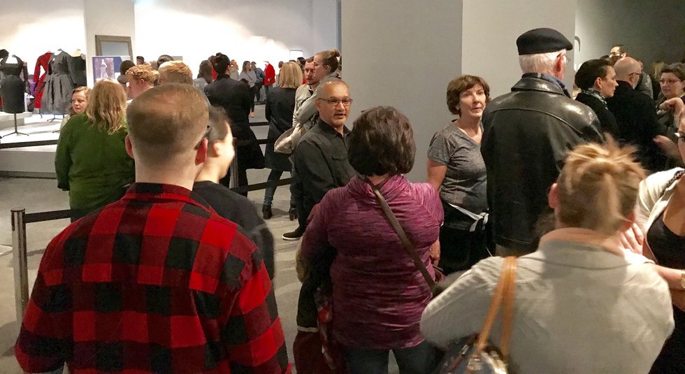 Visitors check out the Christian Dior show during a free evening at the Glenbow in Calgary. (photo by Richard White)