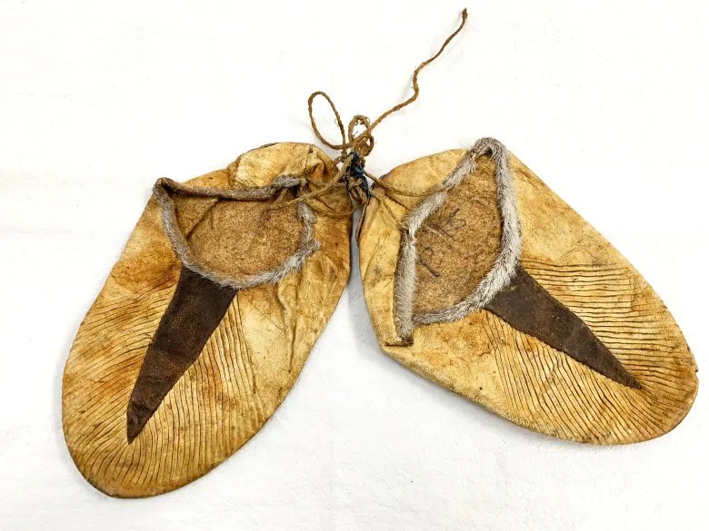 This pair of crimped kamiks made of bleached seal skin is more than 100 years old and among the artifacts added to the Diamond Jenness collection in Cambridge Bay, Nunavut. (photo courtesy of Pitquhirnikkut Ilihautiniq / Kitikmeot Heritage Society)