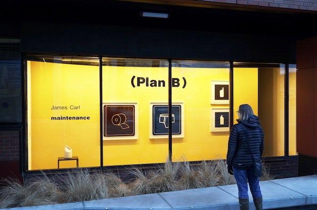 A passerby checks out Toronto artist James Carl's work at the TrépanierBaer gallery in Calgary.