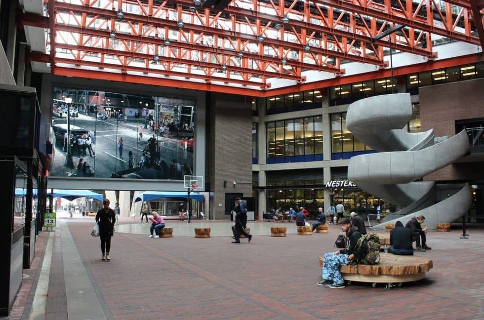 "Abbott &amp; Cordova, 7 August 1971," a photomural by Stan Douglas, is on permanent display in the atrium of the Woodward's redevelopment in Vancouver's Downtown Eastside. (photo courtesy Vancouver Police Museum and Archives)