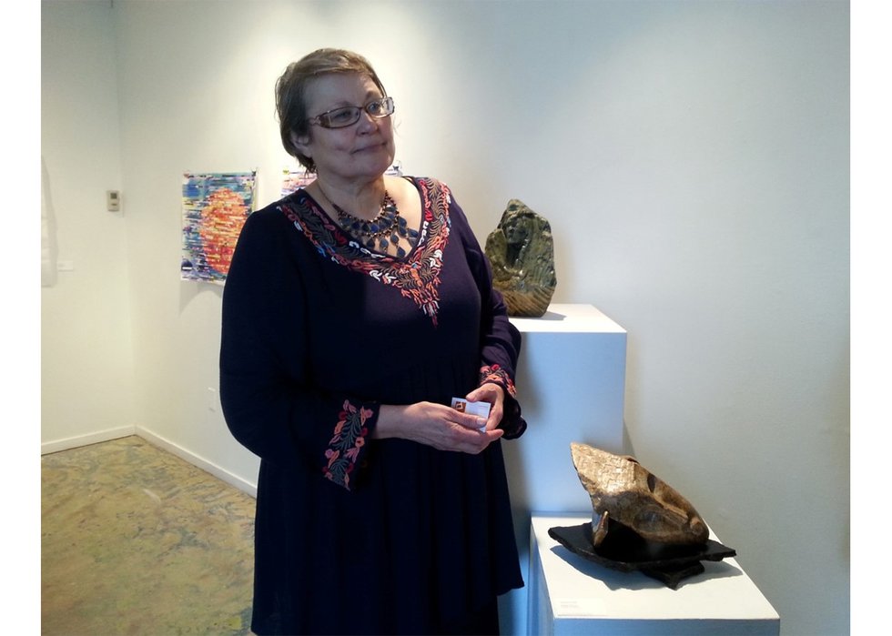 Jacqueline Fiala with her sculptures at CARFAC's New Voices exhibition in 2017. (courtesy Marlena Wyman)