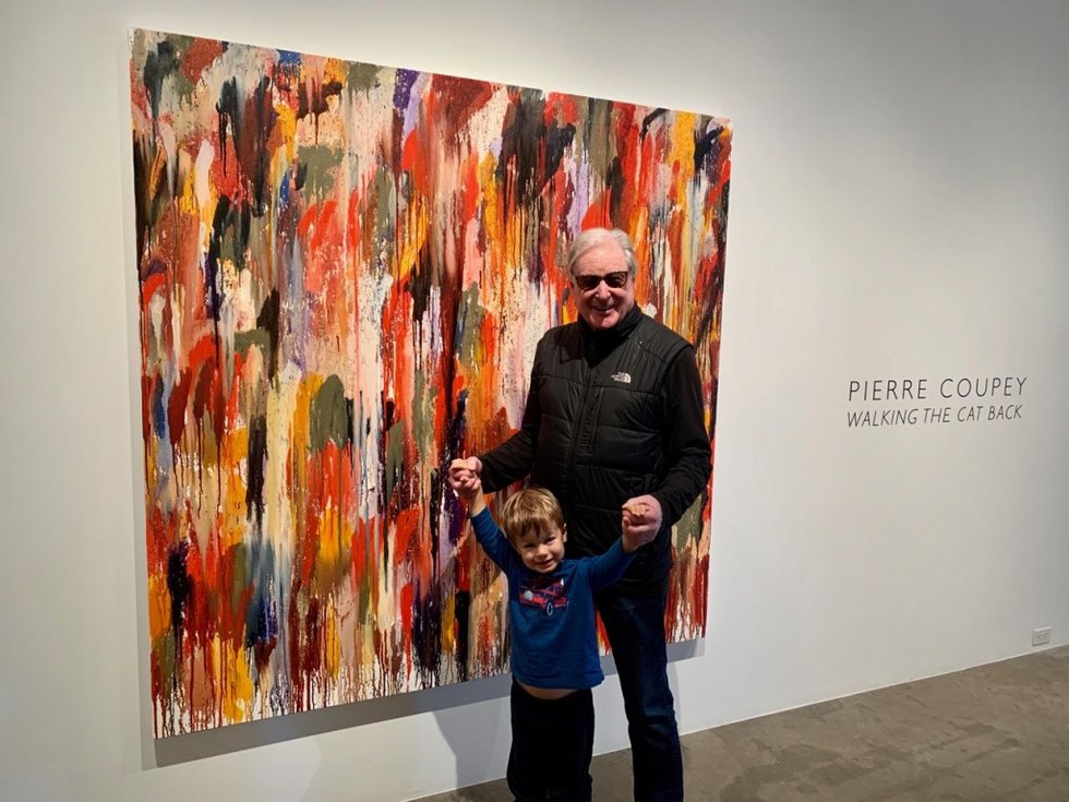 Pierre Coupey and his grandson stand next to his 2020 oil painting "Algonquin II"  at Gallery Jones in Vancouver. (photo by Kristin Man)