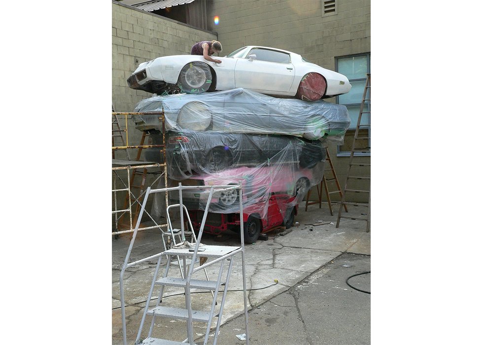 Helene Aspinall working on “Trans Am Totem” in 2014 at what was then the  studio art courtyard at Capilano University in North Vancouver. (photo by Marcus Bowcott)