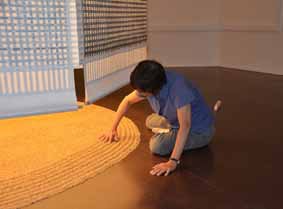 Amy Loewan installing wheat under "Lantern."