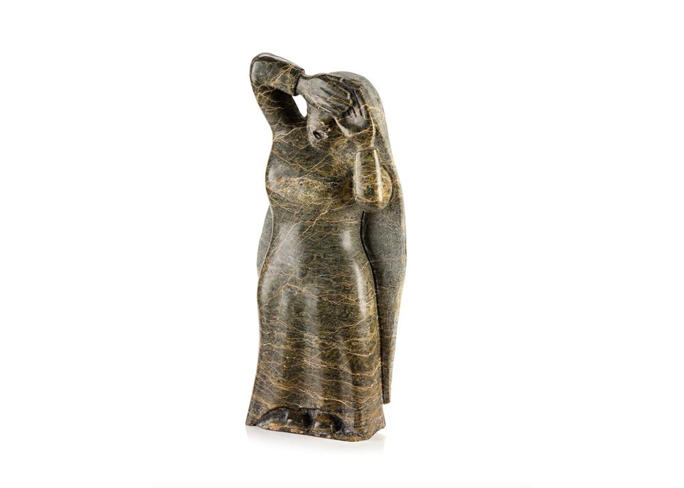 Oviloo Tunnillie, “Woman Shielding Her Face,” 2000, stone, 21.5" x 9.5" x 3.25"