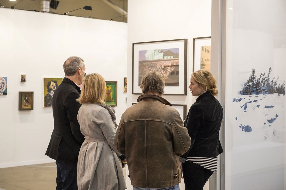 "Collectors speak with the gallery manager of Monte Clark"