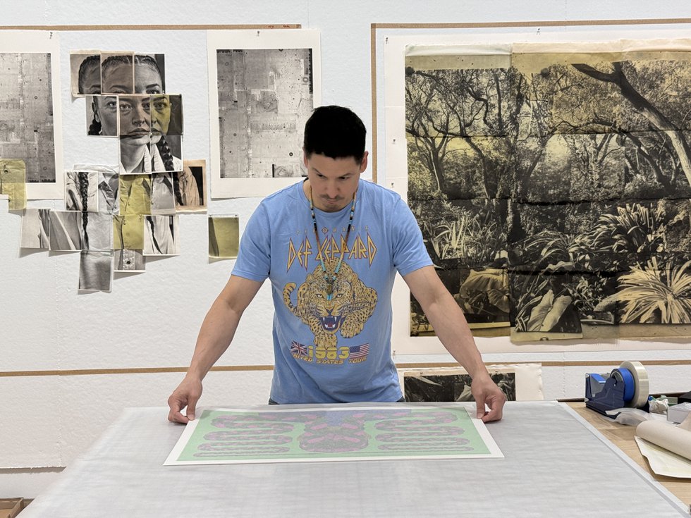 Wally Dion inspects one of his recent silkscreen prints made in collaboration with Smokestack Studio, Hamilton, Ont.