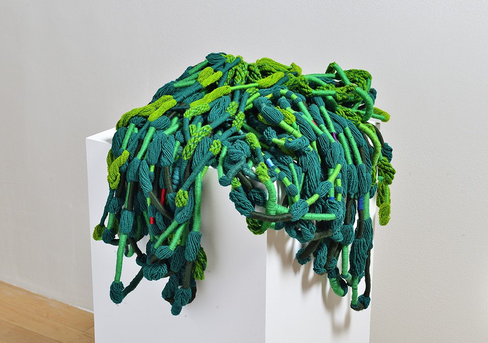 Sheila Hicks, “Peluca verde,” 1960-1961, wool, 24" x 15" (collection of the artist, photo courtesy of Fundacion Amparo — Museo Amparo, Puebla, Mexico)