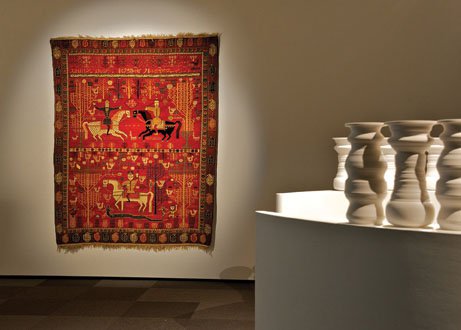 "Shirvan pictorial carpet" (1882-1883) with a partial view of Greg Payce’s "Albedo"